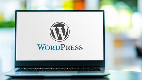 A laptop with the WordPress logo