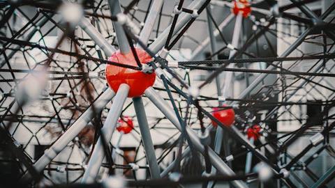 a red sphere with spokes coming out of it